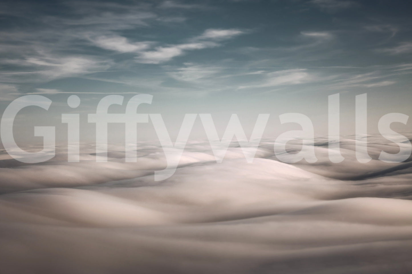 Cloudscape Serenity wallpaper mural close-up of a soft white and blush sea of clouds under a blue-grey sky