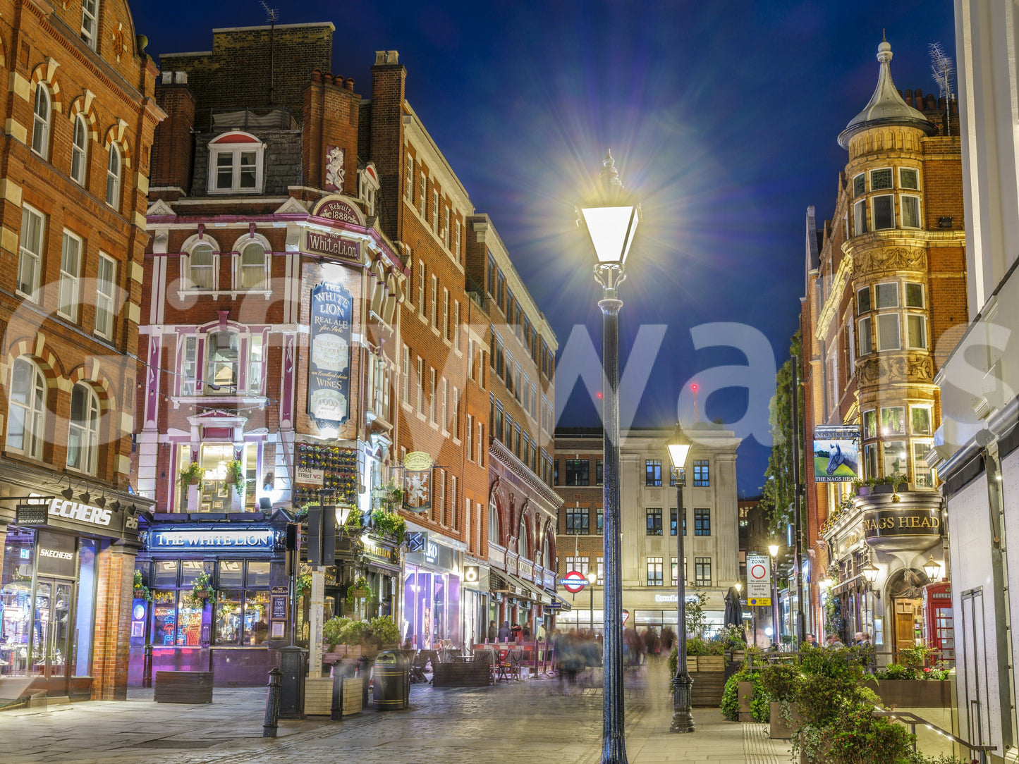 A detail of the warm tones in the street and sky.