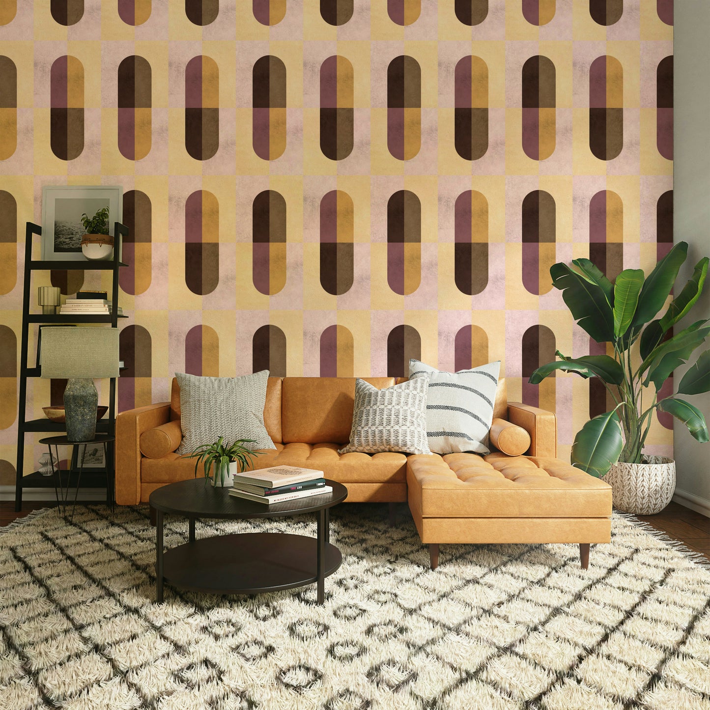 Earthy Geometric wallpaper in a living room with a tan leather sectional and bird-of-paradise plant
