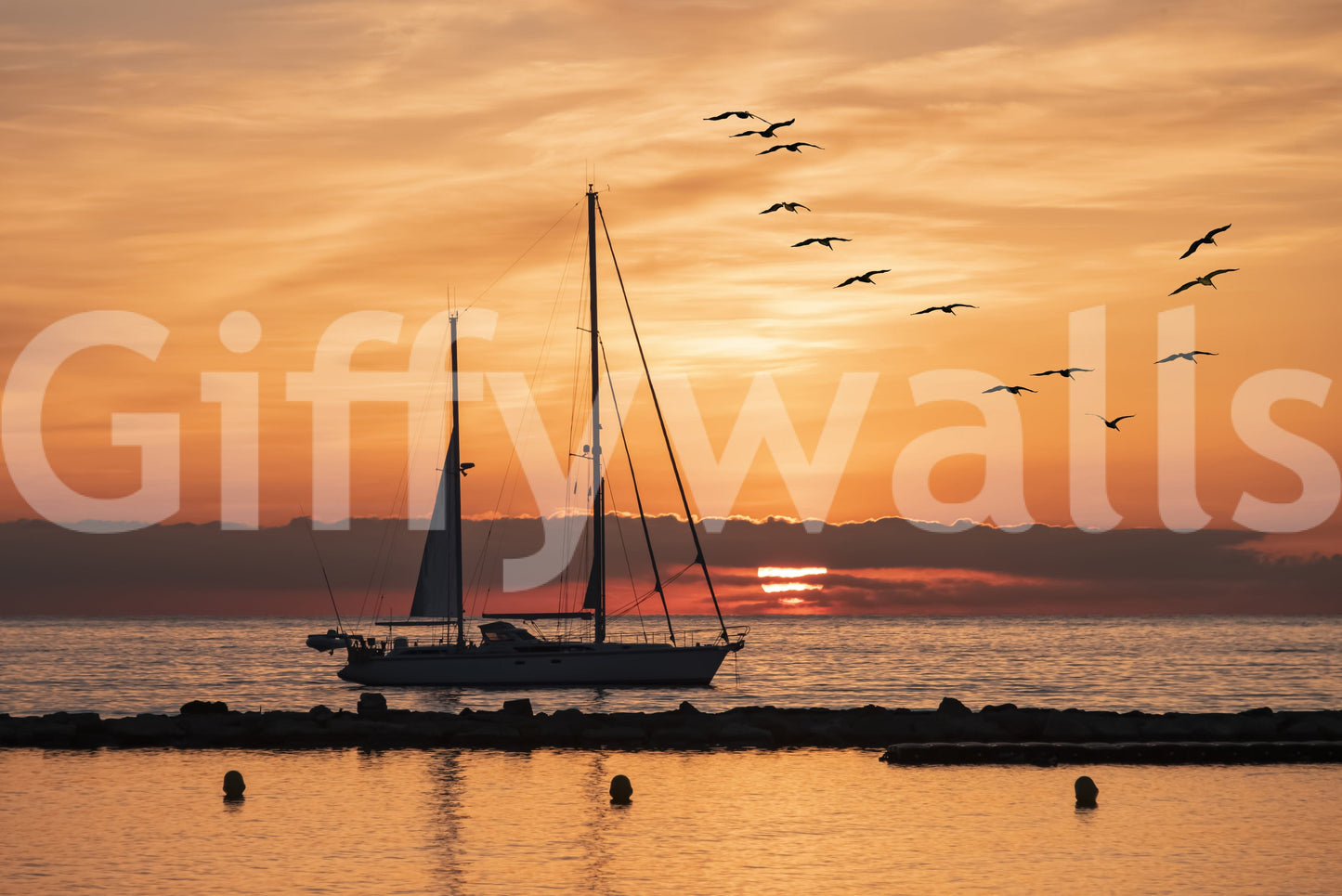 Vibrant Golden Horizon wallcovering serene golden hour water sailboat.