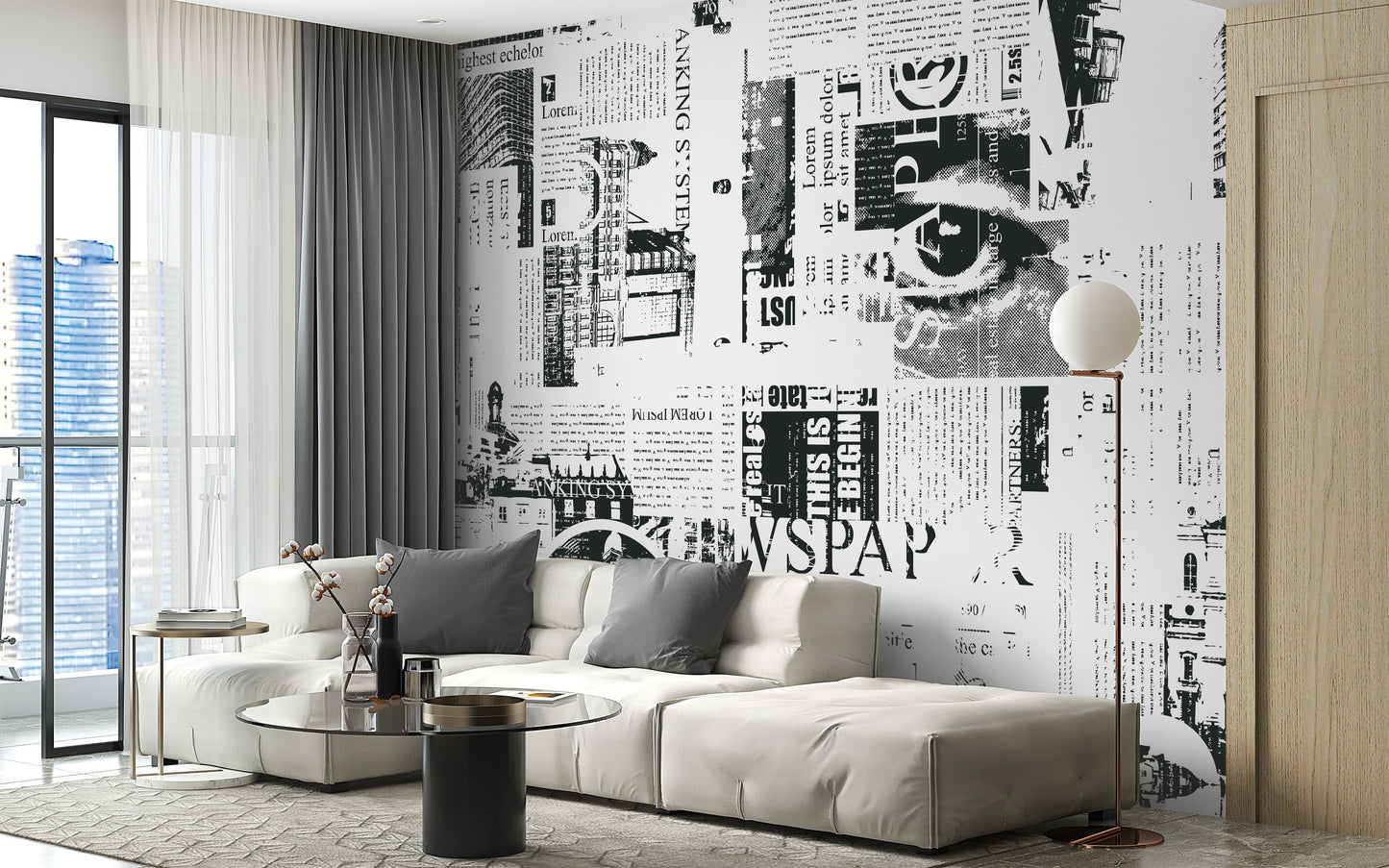 Urban Newsprint wallpaper mural in newspaper collage behind a cream sectional sofa with a city view in a living room