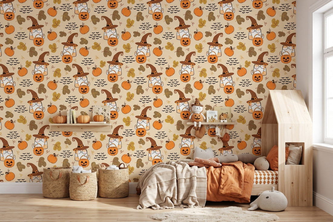 Cozy kids bedroom styled with cheerful Halloween wallpaper of cartoon cats in witch hats and glowing pumpkins on warm beige