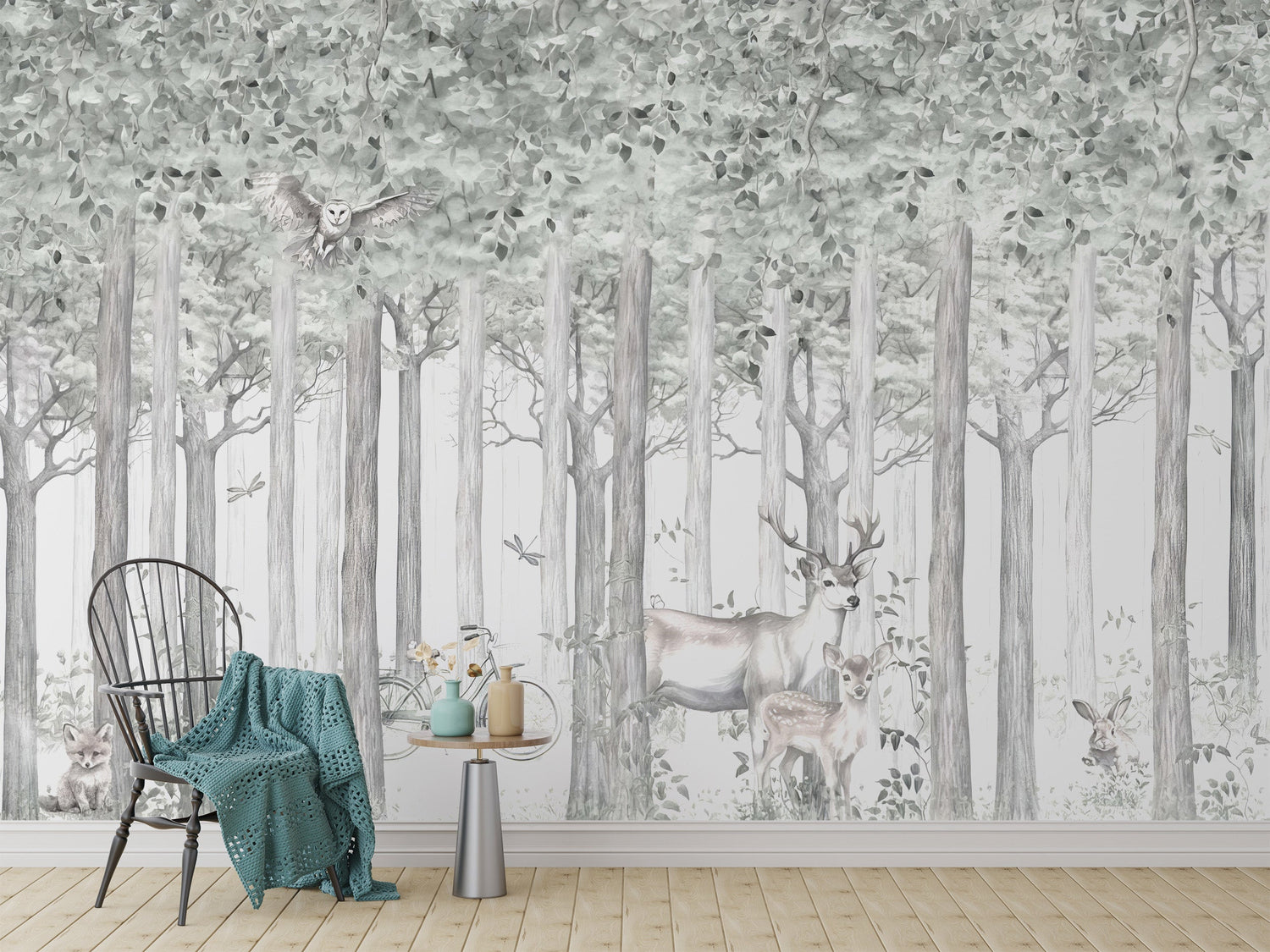 Peel and stick birch tree wallpaper on an accent wall behind a grey sofa in a bright, modern living room.