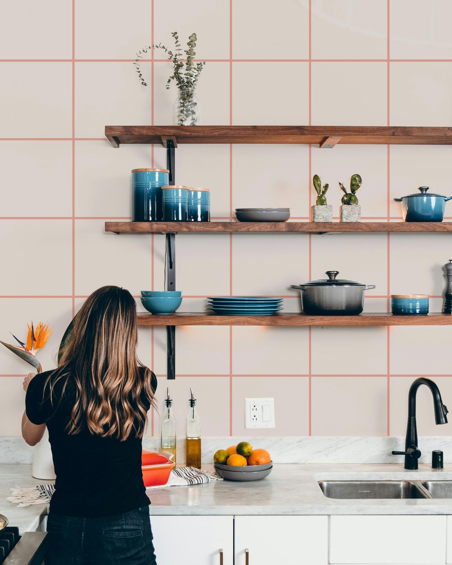 Kathrin Woo geometric triangle wallpaper in a bright room