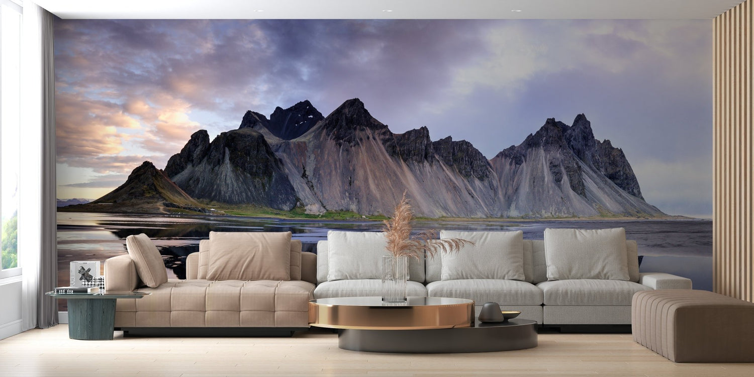 Mountain wallpaper mural featuring snow capped peaks and misty alpine landscape on a feature wall