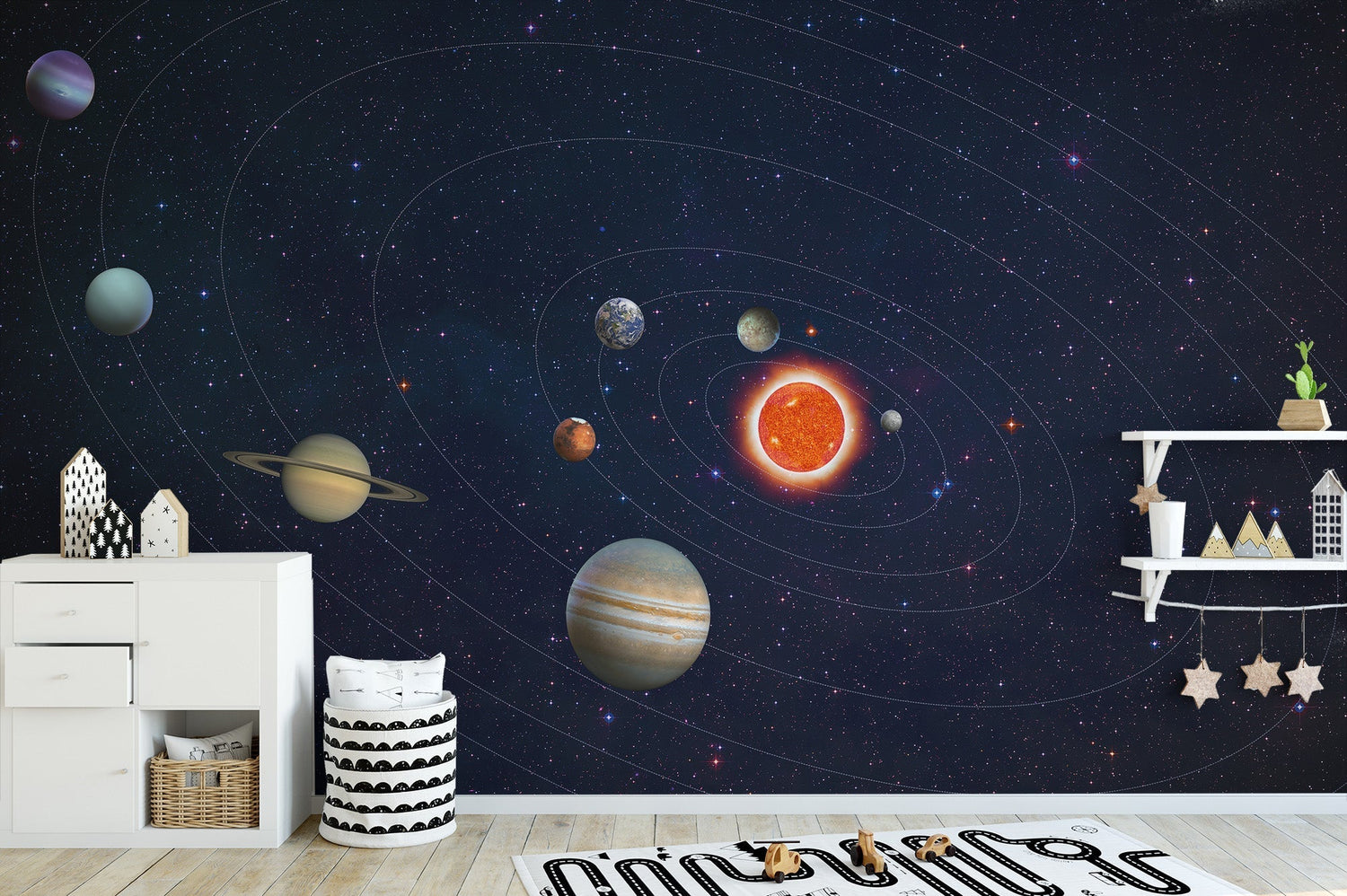 Space wallpaper murals on a kid's bedroom wall