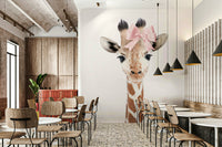 Playful baby giraffe mural with bow in watercolor style