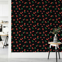 Bold black fruit wallpaper with painterly cherries

