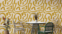 Retro mustard scribbles wallpaper with abstract brush design

