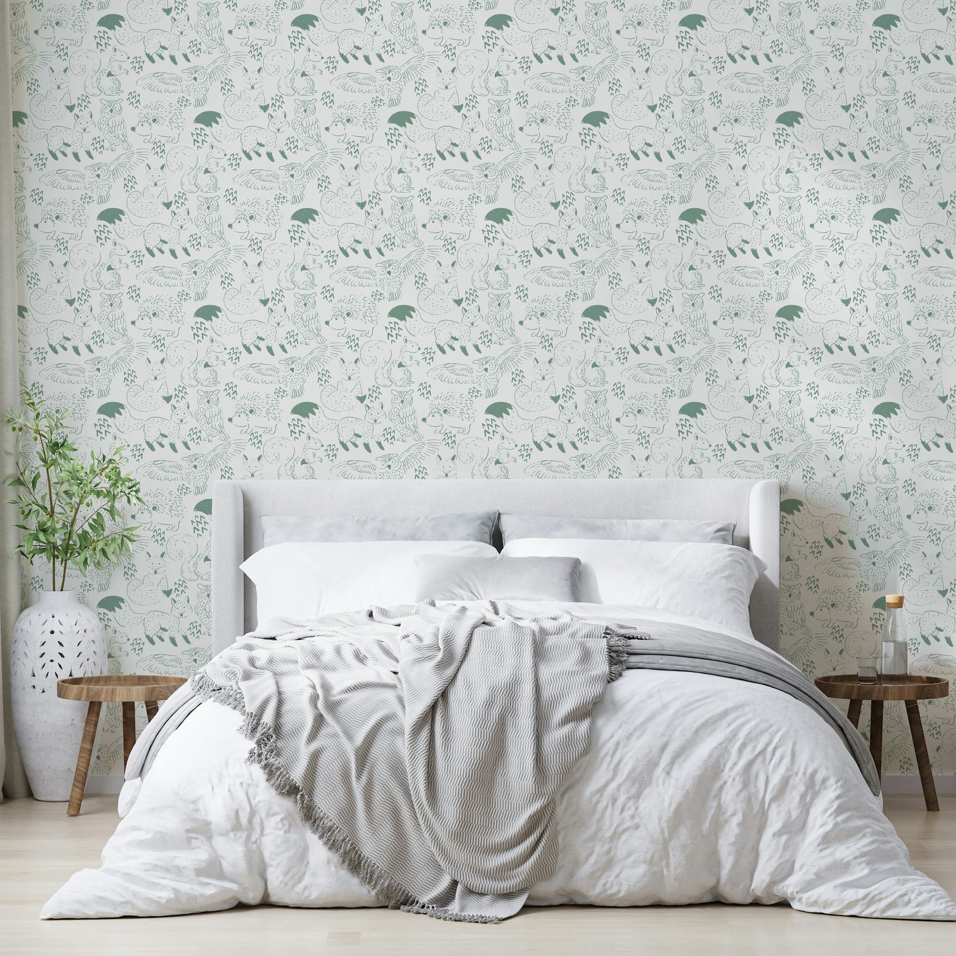 Gentle forest animal wallpaper in calming green

