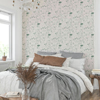 Forest creatures wallpaper in soft green hues


