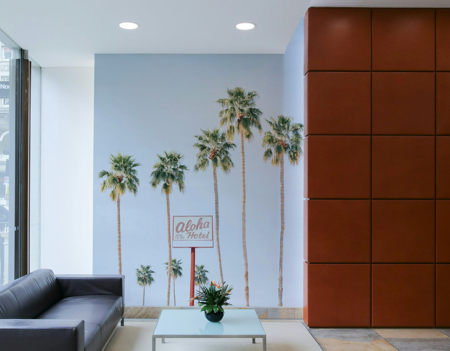 Hawaiian hotel-themed mural with ocean backdrop

