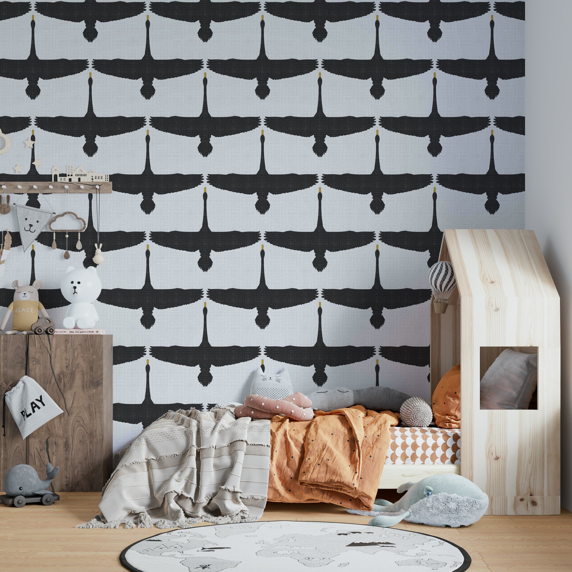 Flying swans on rustic-style gray wall covering

