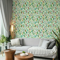 Colorful festive trees on cheerful green wallpaper


