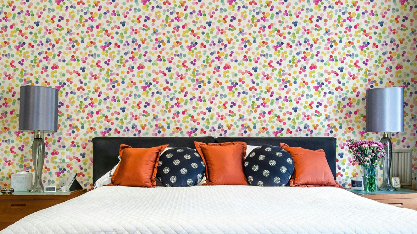 Festive wallpaper with colorful confetti dots


