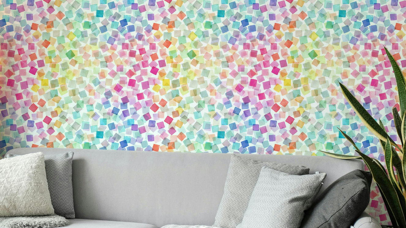 Bold plaid wallpaper with rainbow confetti elements

