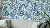 Deep jungle leaves wallpaper in shades of blue

