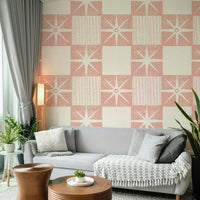 Mid-century modern wallpaper with pink starburst motif

