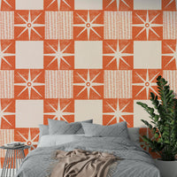 Mid-century starburst wallpaper in muted salmon orange

