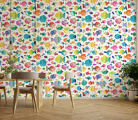 Light blue marine mural with playful puffer fishes and shells.

