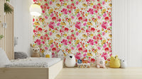 Floral wallpaper featuring soft pink and yellow flowers with green foliage.

