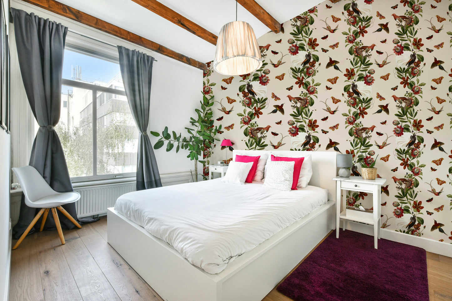 Lush tropical plants and colorful flowers in vibrant wallpaper design

