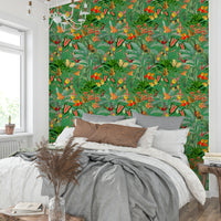 Lively emerald green and tropical botanicals in wallpaper design

