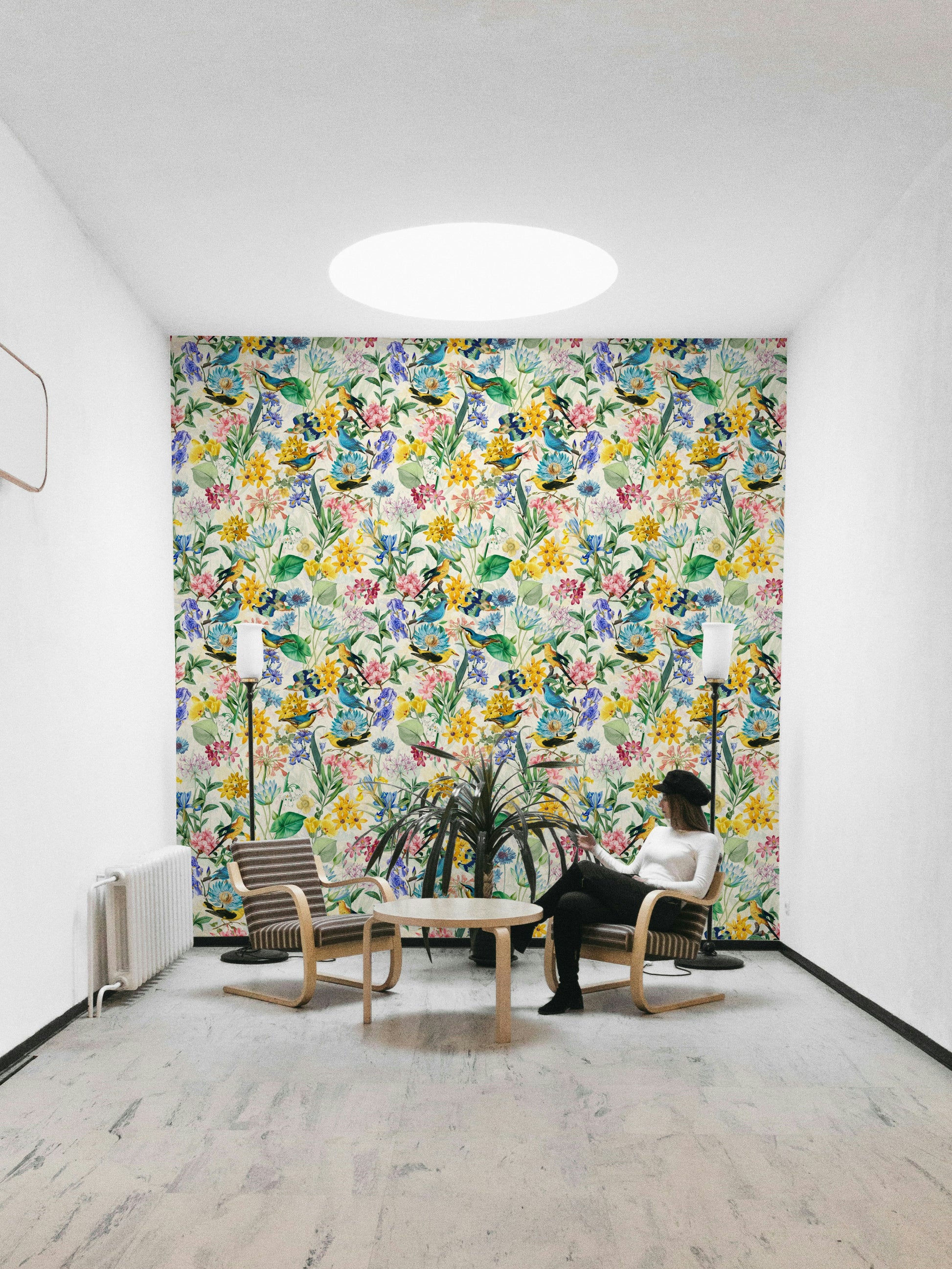 Birds perched on flowers in a beautiful, nature-inspired wallpaper design


