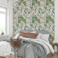 Floral wallpaper mural with soft pastel tones and gentle leaves.

