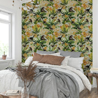 Opulent wallpaper with tropical foliage and golden details.

