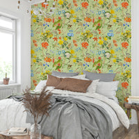 Wallpaper with vibrant tropical leaves and exotic birds.

