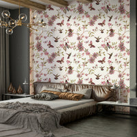 Vibrant mural featuring birds, blossoms, and butterflies on black.

