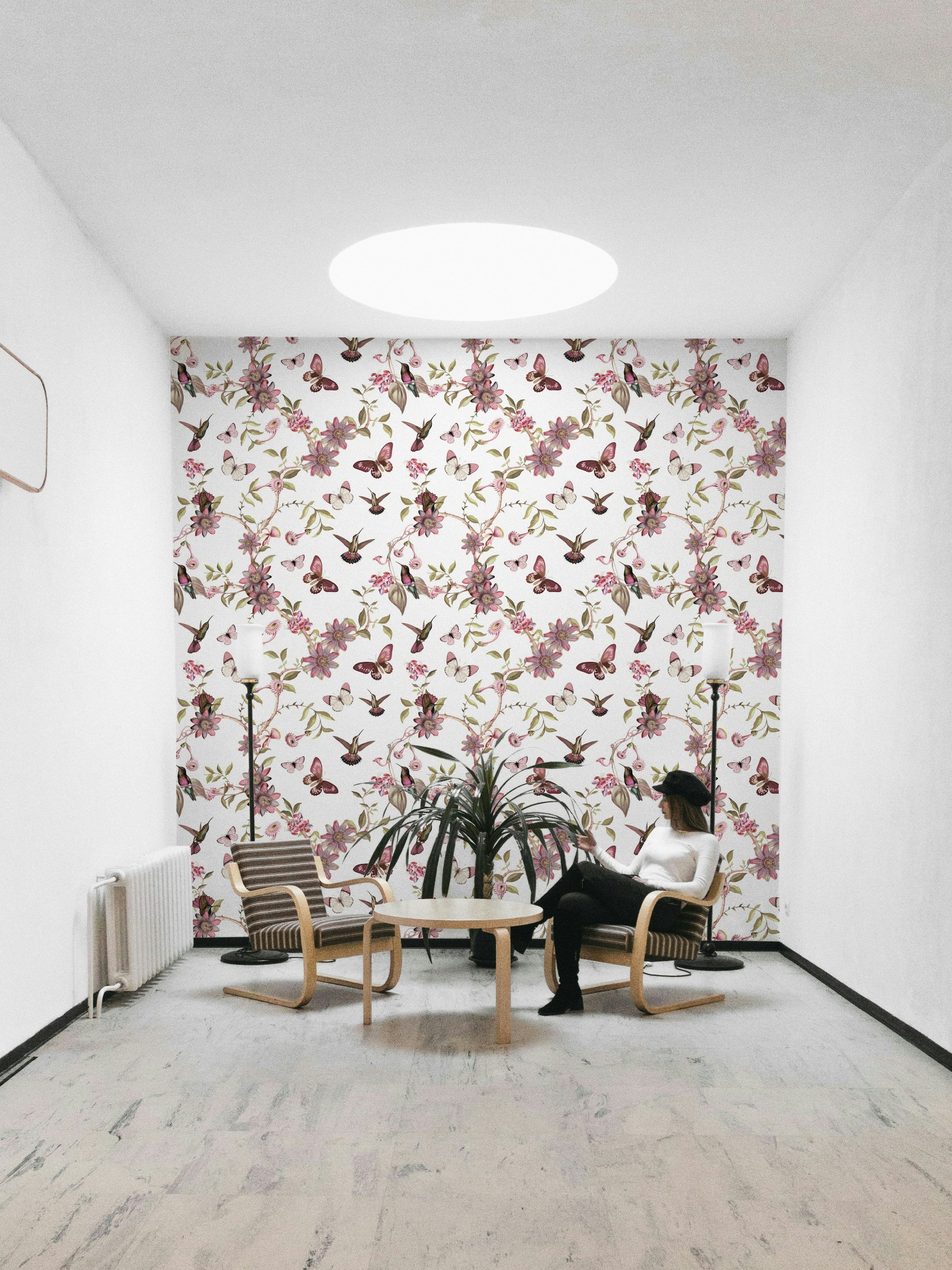 Garden-inspired wallpaper with bold blooms and flying insects.

