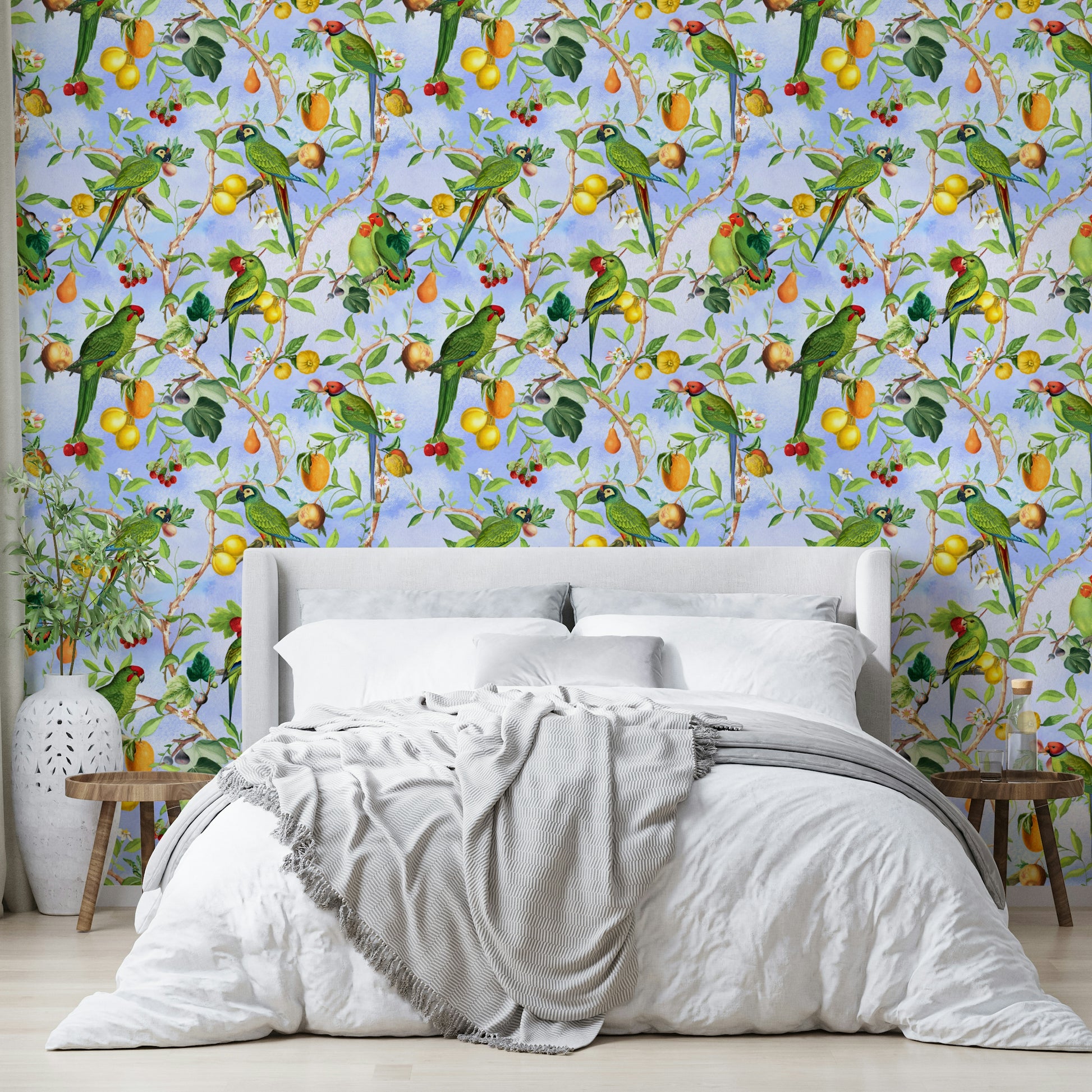 Tropical mural with birds perched on leafy branches.

