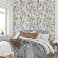 Chinoiserie wallpaper mural with subtle florals and flowing vines.

