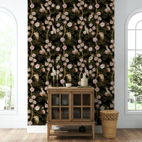 Subtle tropical wallpaper in soft greens and warm neutrals.

