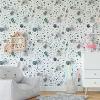 Space-themed mural with glowing stars, planets, and swirling galaxies.

