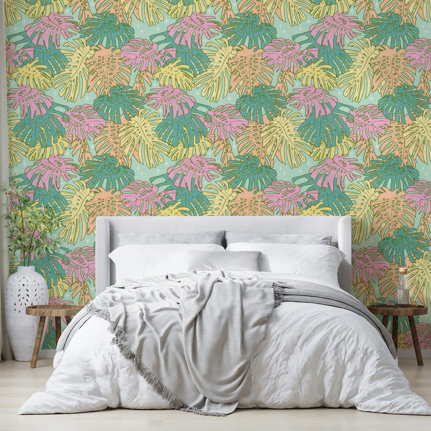 Aqua and pastel green Monstera leaf wallpaper with vintage Palm Springs style.

