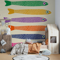 Tropical fish design with rainbow hues on a cream wall mural.

