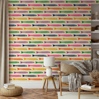 Lively anchovies swimming on a soft cream wallpaper for playful interiors.

