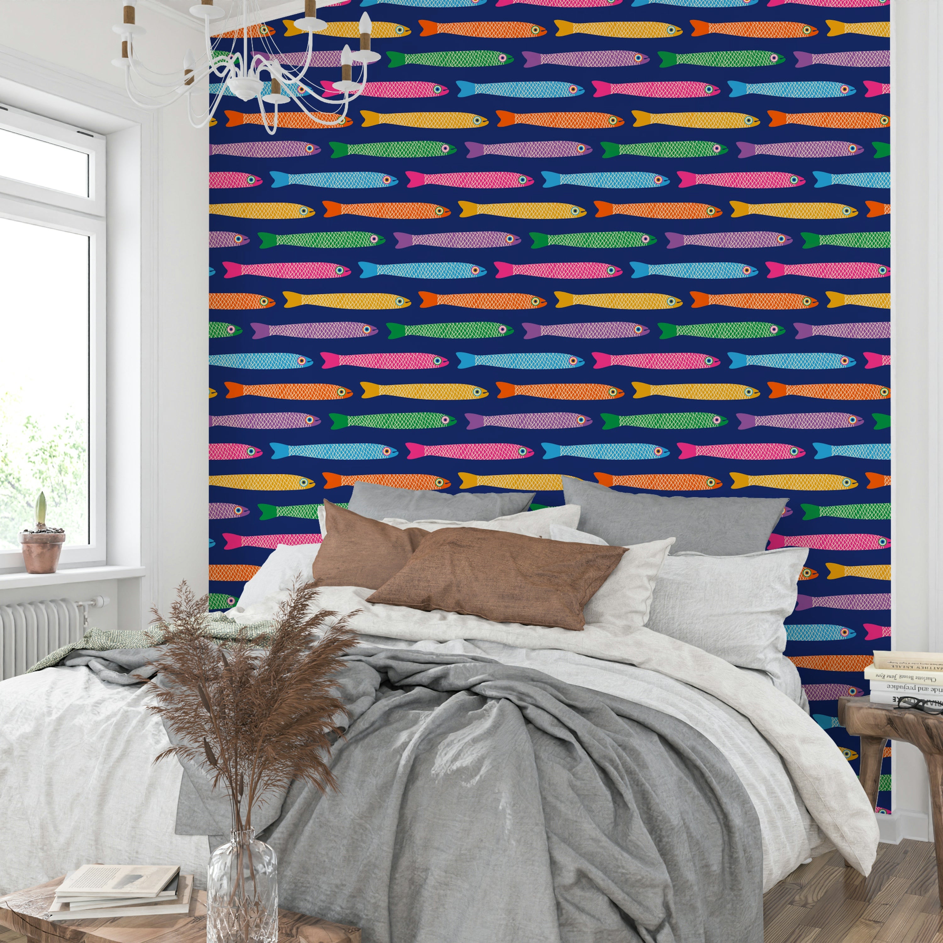 Rainbow fish swimming across royal blue wallpaper for a joyful look.


