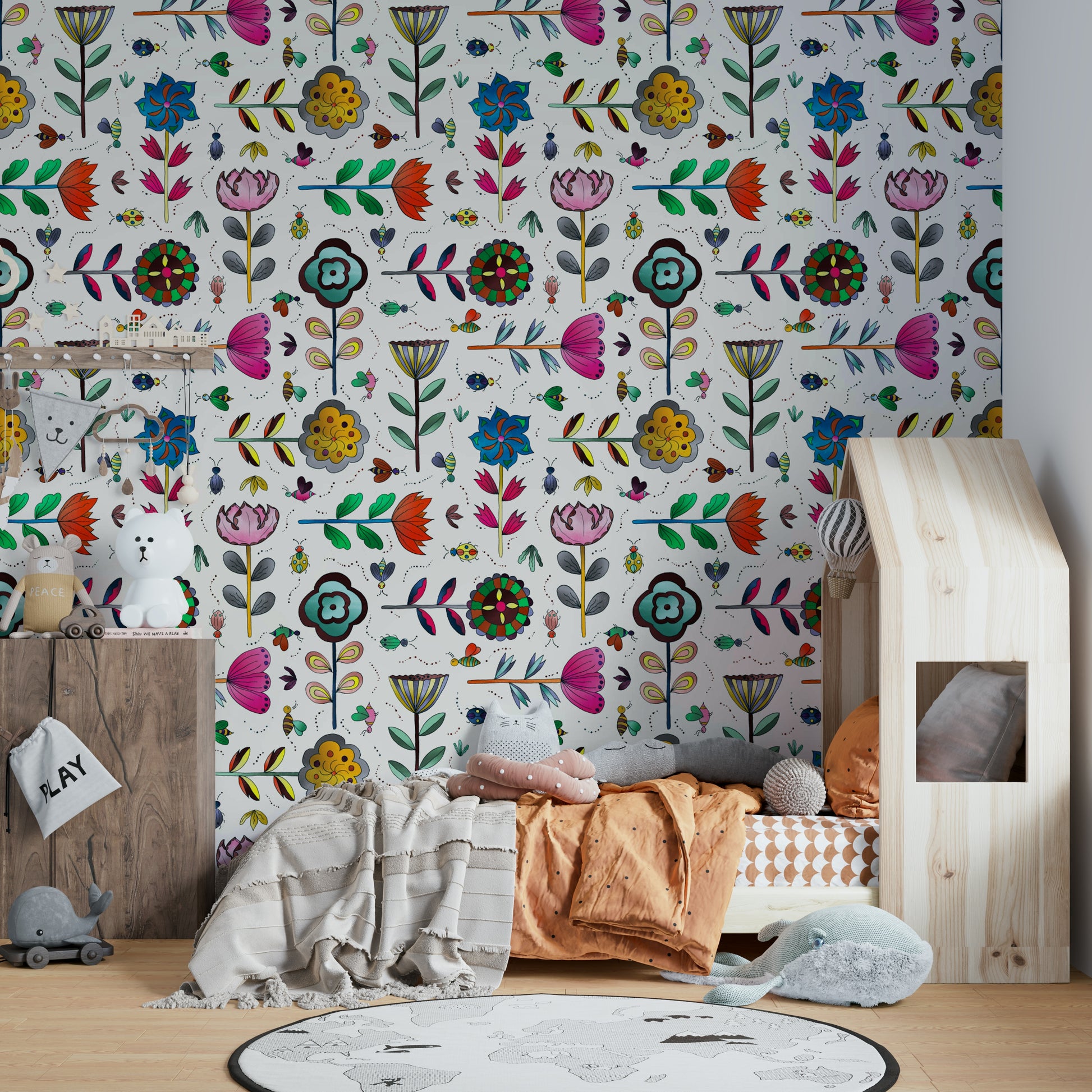 White wall mural with bugs and flowers

