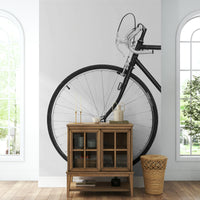 Bicycle mural in hallway with wooden bench

