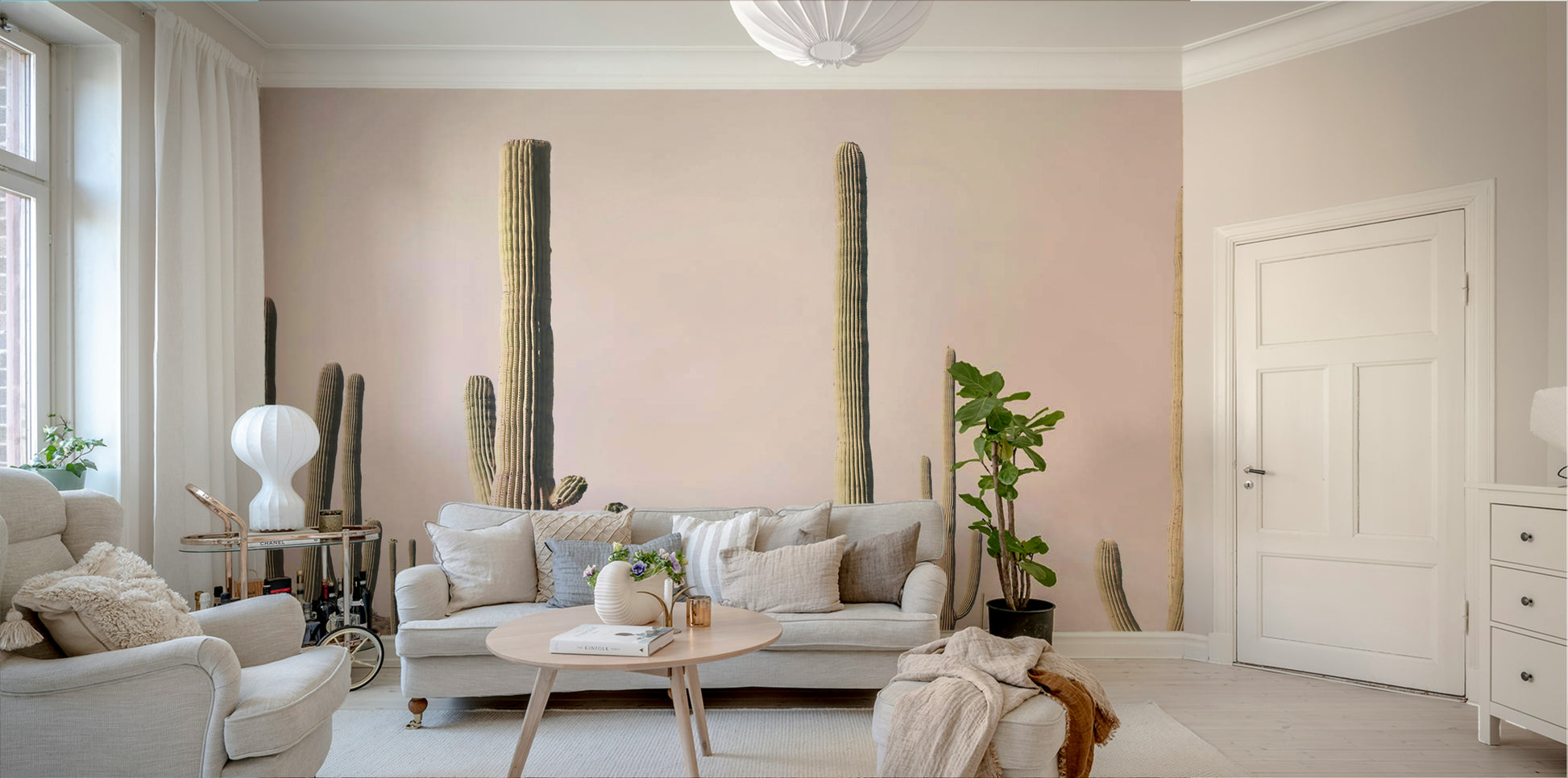 Desert-inspired mural with soft pink cactus silhouettes


