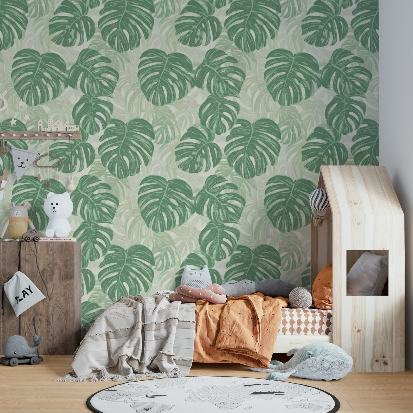 Monstera leaf wall mural creating a tropical atmosphere.

