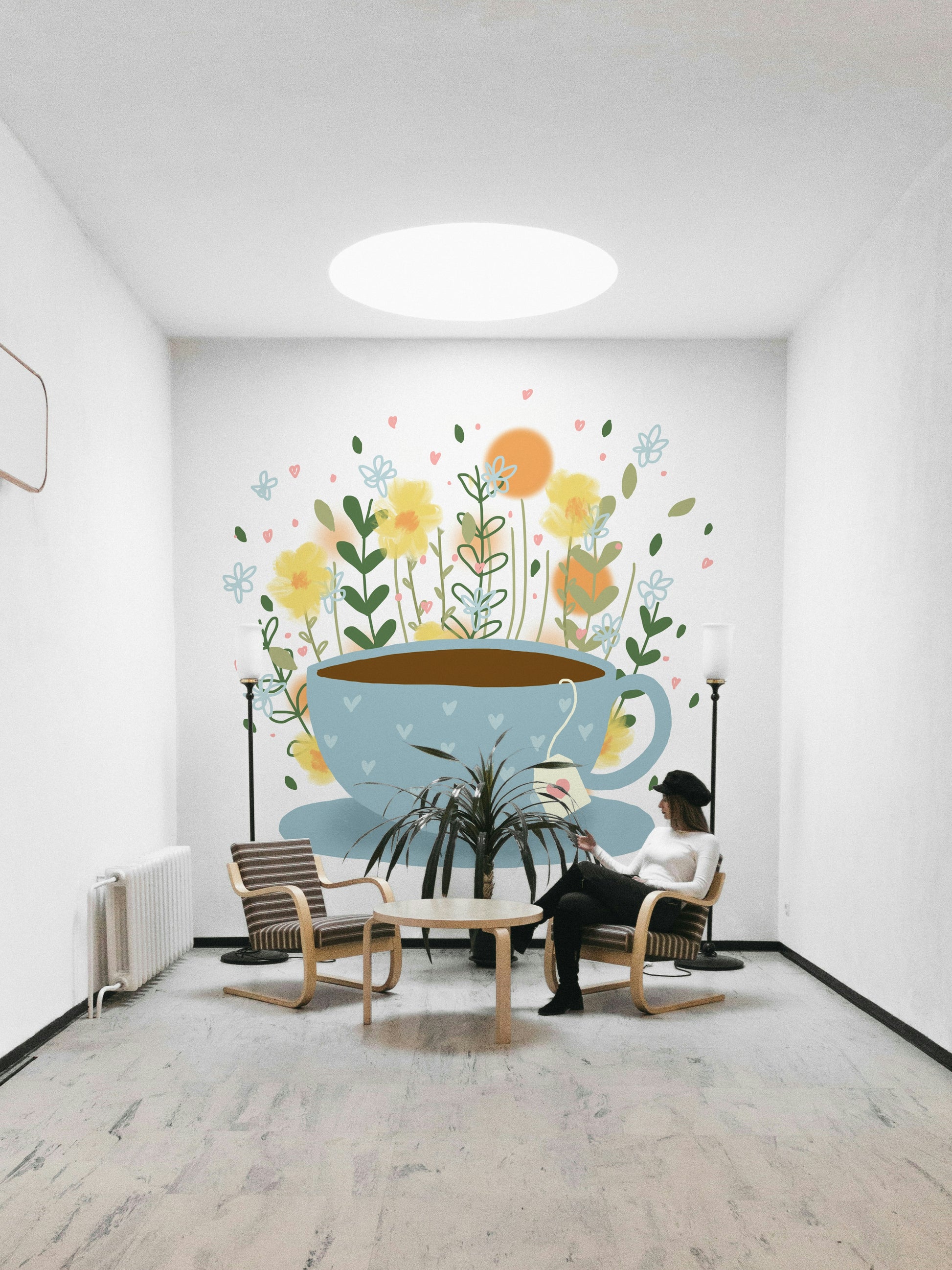 Floral tea break mural with gentle pastels and floral tea set

