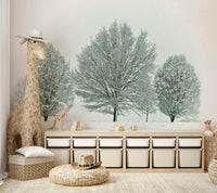Snow-covered trees and soft landscape mural for a calming atmosphere.

