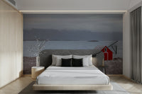 Coastal Hideaway Wall Mural featuring a red cabin by the sea.

