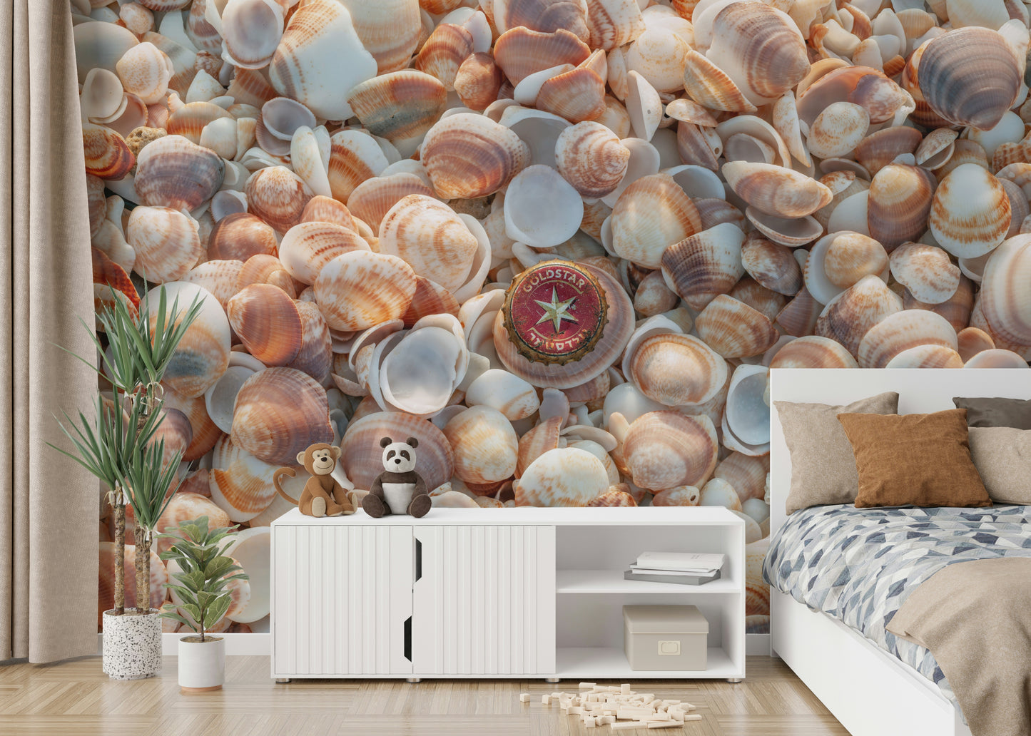 Beach Treasures wall mural with smooth stones and shells on the sand.

