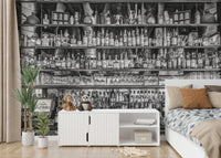 Vintage bar mural featuring shelves of spirits and glasses

